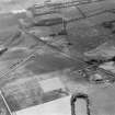 Oblique aerial view centred on the cropmarks of the unenclosed settlement, linear features and pits at Gilrivie and Pugeston, looking to the WSW.
