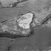 Oblique aerial view centred on the cropmarks of the unenclosed settlement, ring ditches, souterrain, pit alignment, rig and linear features at Arrat's Mill, looking to the NNE.