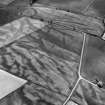 Oblique aerial view centred on the cropmarks of the pit defined cursus, enclosed cremation cemetery, rectilinear enclosure, ring ditch and rig at Balneaves, looking to the SE.