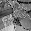 Oblique aerial view centred on the cropmarks of the unenclosed settlement, enclosure, ring ditches, pits and rig at Damside and Pitmuies, looking to the ESE.