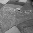 Oblique aerial view centred on the cropmarks of the barrow and the rectangular building at Newton of Lewesk, looking to the NNW.