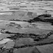 Oblique aerial view centred on the cropmarks of the rig at Wardhouse and Fallow Hill, looking to the SSE.