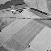 Oblique aerial view centred on the cropmarks of the enclosed settlement, ditch defined cursus, enclosure, ring ditches, barrows, pits and rig with the farmstead adjacent, looking to the WNW.