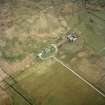 Oblique aerial view centred on the house and farmsteading, taken from the NW.