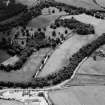General oblique aerial view of Pitcaple Castle with the cropmarks adjacent, looking to the SW.