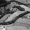 General oblique aerial view of Pitcaple Castle with the cropmarks adjacent, looking to the SSW.
