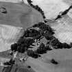 Oblique aerial view of Tarradale House with the cropmarks adjacent, looking to the NW.