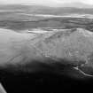 Oblique aerial view centred on the remains of the vitrified fort at Tap O' Noth, looking to the SE.