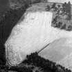 Oblique aerial view centred on the cropmarks of the barrow and pits at Mill of Kincraigie, looking to the E.