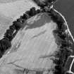 Oblique aerial view centred on the cropmarks of the possible enclosure and ring ditches at Haughs of Kinnaird, looking to the NE.