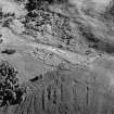 Oblique aerial view centred on the remains of the township and rig at Glen Muick, looking to the E.