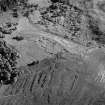 Oblique aerial view centred on the remains of the township and rig at Glen Muick, looking to the NE.