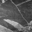 Oblique aerial view centred on the remains of a settlement, ring ditches and field system at Burn of Mannie, looking to to the NNE