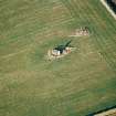 Oblique aerial view centred on the remains of the recumbent stone circle, taken from the SSW.