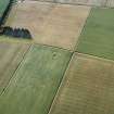 Oblique aerial view centred on the remains of the recumbent stone circle, taken from the SW.