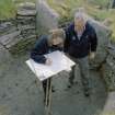 Survey in progress: Mr Alan Leith and Ms Georgina Brown (Both RCAHMS) in picture.
Digital copy of photograph.
