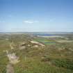 General view over Loch of Yarrows, taken from the Yarrows Archaeological Trail (c. ND 304 426). The farmstead is in the middle distance, beside the large tree.