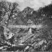 Copy of historic photograph showing general view from S.
Titled: 'Raehills Glen & Bridge, Moffat'.
Copied from an album, "Views of Moffat. Published by William Forrest. High Street, Moffat.", borrowed from Mr Maxwell-Irving.