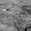 Oblique aerial view centred on the steelworks and Mossend village.