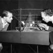 Festival of Britain, Exhibition of Industrial Power, Hall of the Future.
Victor Prus and J R Atkinson viewing the atomic energy display model.