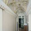 Interior. View of hallway showing vaulted ceiling looking towards entrance