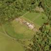 Oblique aerial view showing house, formal gardens, coach house and stables from SW.