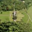 Oblique aerial view of house and formal gardens from SSE.