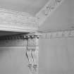 Interior.
Detail of cornices and console bracket at junction of ground floor ceiling and staircase.