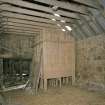 Interior of byre showing remains of theshing machine