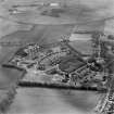 Oblique aerial view centred on Kingseat Hospital, taken from the E.