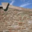 Detail.  Triangular coping stone on W wall of walled garden from W.