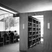 View of library study area and bookshelves.