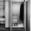 View of open wardrobe in Chamberlain Hall study bedroom.
