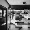 Interior.
View of research entrance and canopy from entrance hall of agricultural science building from interior.