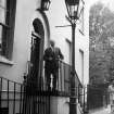 Sir Basil Spence outside his home and office at 1 Canonbury Place, London.