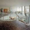 Interior.
View from SE of circular stair on upper floor of office block.