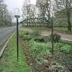 Detail of roadside 1930's 'Crook Hotel' sign to S attributed to Thomas Haddon and Company.