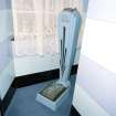 Interior.
Ladies' toilet, detail of 'Autoway' weighing machine.