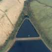 Scanned oblique aerial view of the gauge basin and measuring pond of Craigmaddie (NS57NE 61) Reservoir