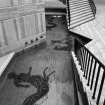 External view of the courtyard pool with mosaic at the foot of the stairs, British Embassy, Rome.