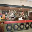 Interior. Upper circle bar, view of bar with mural behind