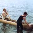 'Loch Doon' logboat experimental reconstruction (at Scottish Fisheries Museum, Anstruther): spring 1992. Launch day: logboat in water, with Philip Robertson paddling.
