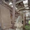 Interior. View in 1950's pan mill, bucket elevator on right.