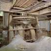 Interior. Pan House from 1950s. View of pan mill. Clay visible in the foreground.