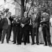 View of a group of people including Basil Spence and Sir Patrick Hancock at the Topping Out ceremony.