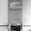 Detail of mirror and fireplace.