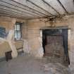 Interior. Kitchen showing fireplace and range