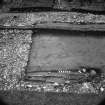 Digital copy of excavation photograph: Grave II inside the NE corner of chapel from N.