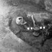 Digital copy of excavation photograph: Grave V from SE showing chalice.