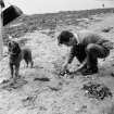 Digital copy of personal photograph: man on the beach.